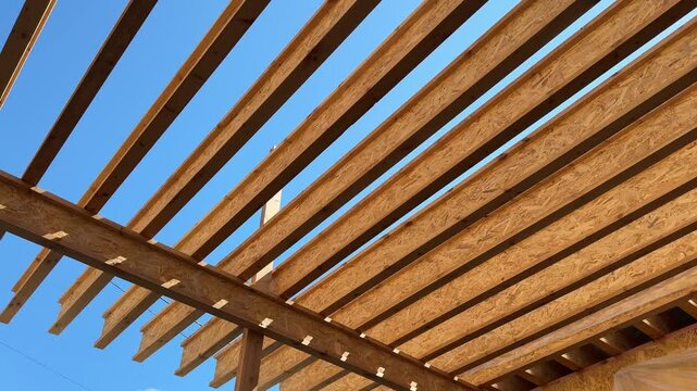 Wooden Pergola Frame Being Built Over a Terrace