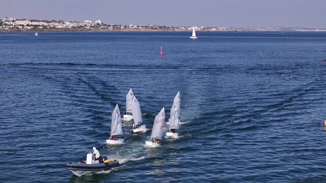 Cascais, Portugal - 02 July 2026: Aerial view of small sailboats racing on the blue waters of the Atlantic Ocean.