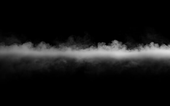 Low lying dense white smoke line spreading horizontally on black background for ground fog effect. Solid layer of thick vapor mist crawling across dark empty space floor surface.