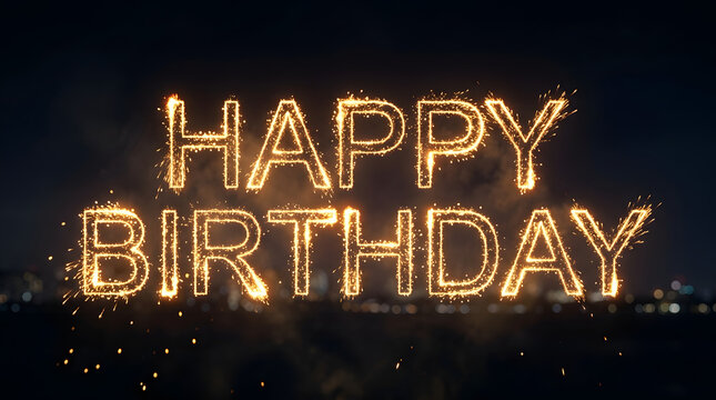 Happy birthday message spelled out in bright glowing sparkler fireworks with visible sparks and trails against a dark night sky background featuring celebration, light, text, party and festive