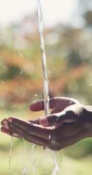 Water, organic and person washing hands outdoor for hygiene, health or self care in countryside. Sustainability, nature and liquid for cleaning skin for dirt, germs or bacteria removal on farm.