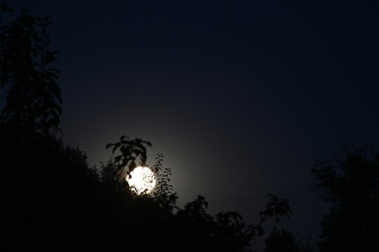 moon in the night sky, Bright full moon shining in a clear night sky.