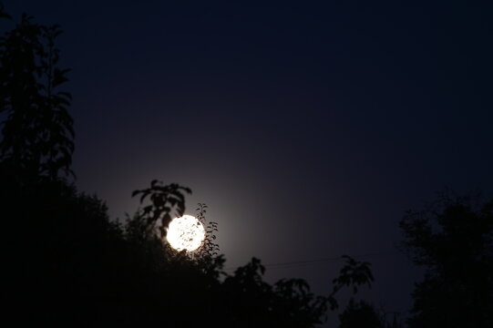 moon in the night sky, Bright full moon shining in a clear night sky.