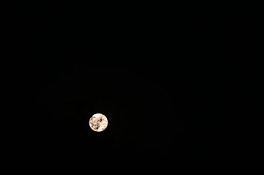 moon in the night sky, Bright full moon shining in a clear night sky.