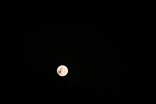 moon in the night sky, Bright full moon shining in a clear night sky.