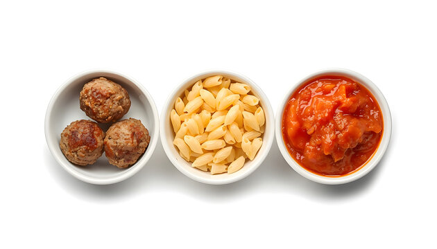 Bowls of meatballs, pasta and tomato sauce. Ingredients for a classic Italian meal.