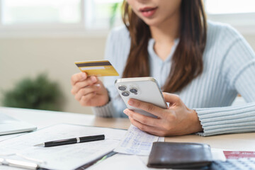 Obraz na płótnie Canvas person pay bills via mobile banking at home