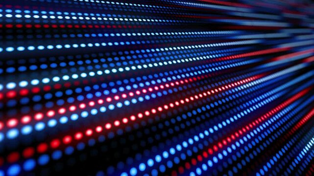 Abstract background of glowing red, white, and blue dots moving rapidly into the distance.