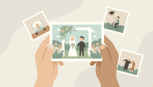 Hands holding a photograph of a wedding couple with other family photos nearby, symbolizing cherished memories and family milestones.