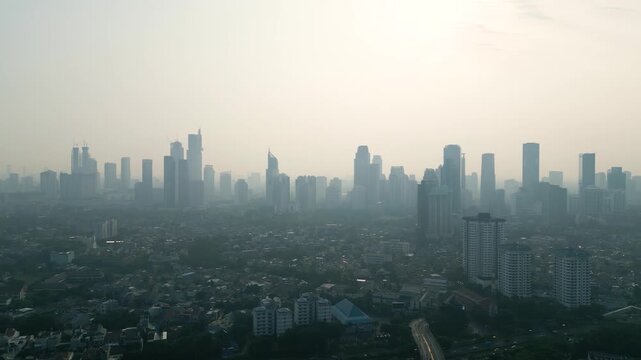 Dense Air Pollution and Smog Covering City Skyline at Morning