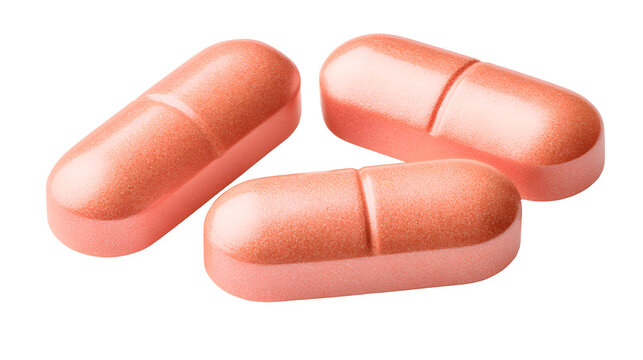 Three peach-colored pills white background, medication tablets for health and wellness