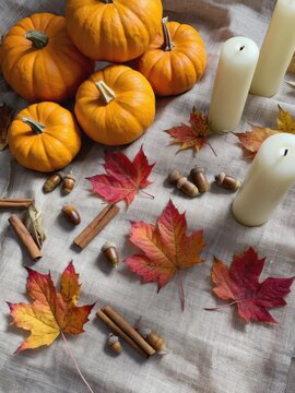Autumn still life with pumpkins leaves and candles