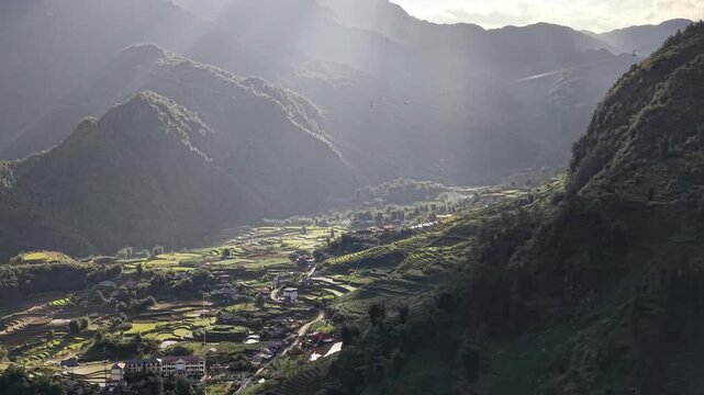 Aerial View of Sunbeams Shining over Terraced Rice Fields and Cable Car in Sapa at Sunset