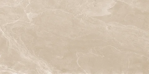 Beige marble texture with soft white veining and natural stone details. Elegant surface for ceramic tiles, flooring, walls, and interior design. © Vidal