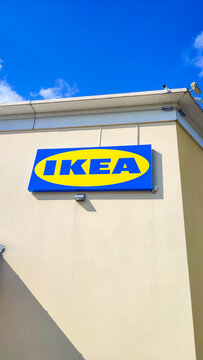 Le Mans, France - July 26, 2026: IKEA store sign displayed on building exterior against clear blue sky, bright colors and branding visible