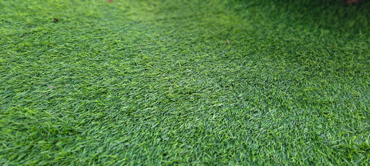 Green artificial grass turf surface texture background for sports and decoration © ADP