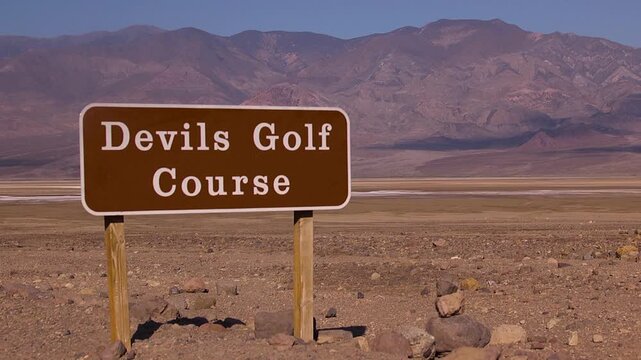 Wide shot of devils golf course sign
