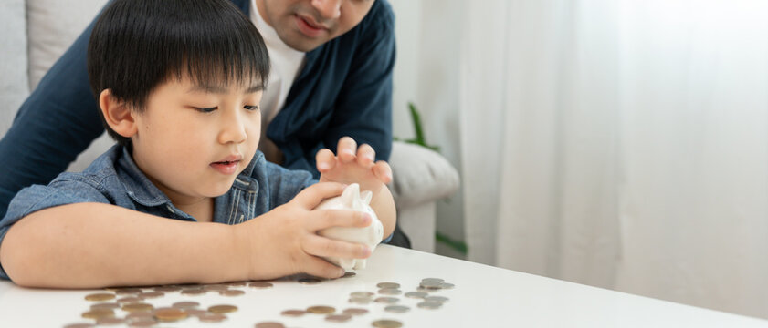 Child happy lean Save money. father teaching son for saving. wealth, Finance, insurance, investment, education, future, plan life, banking, family, health, health and accident insurance.