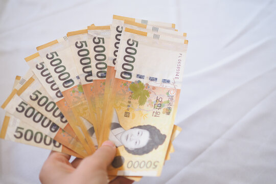 The currency of Korea which is used to represent value in exchange and the won is the main currency of Korean people. Korean won notes for money concept background.