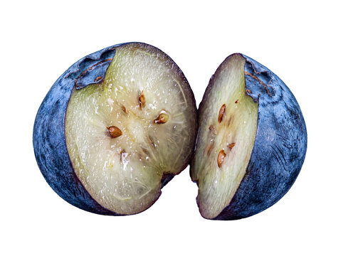 Two fresh blueberry halves slightly separated, revealing juicy interior and tiny seeds.
