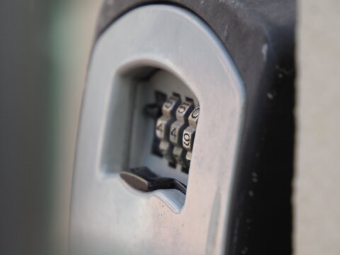 Close up of a digital code lock on a wall for secure access to a property.