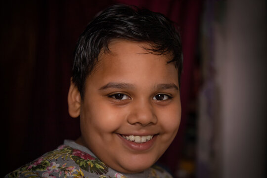 portrait of a young boy smiling