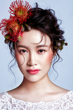 Asian women in white wedding dresses