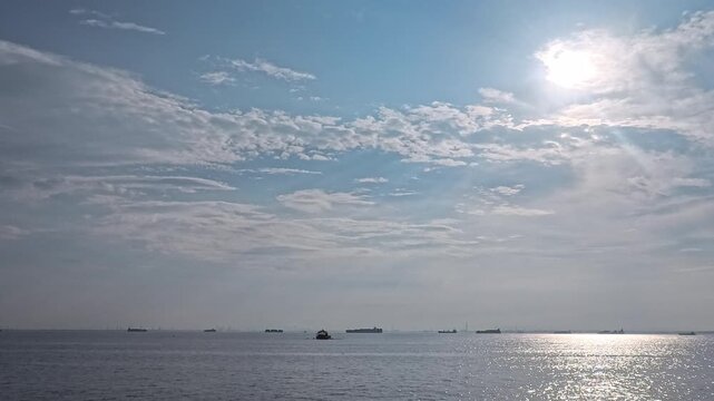 Global shipping network and international trade background footage featuring freight vessels and bright sea
