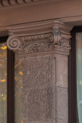 Elements of architectural decorations of buildings, columns and capitals, gypsum moldings, wall textures and patterns. On the streets in Catalonia, public places. © Kozlik_mozlik