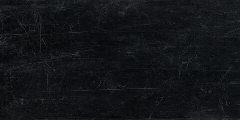 Dark scratched blackboard or chalk board or black wall background with white chalk marks and various stains © DAIYAN MD TALHA