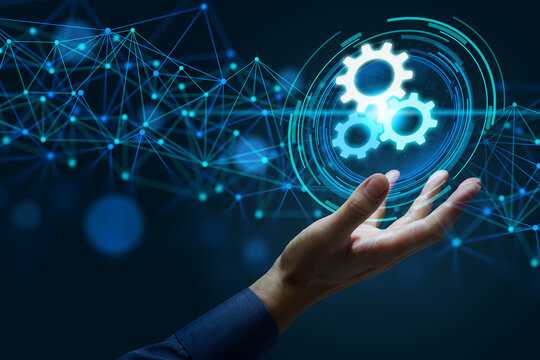 Business automation solutions connecting data and business processes. Applications integrating workflows with task management. Businessman holding gear icons.