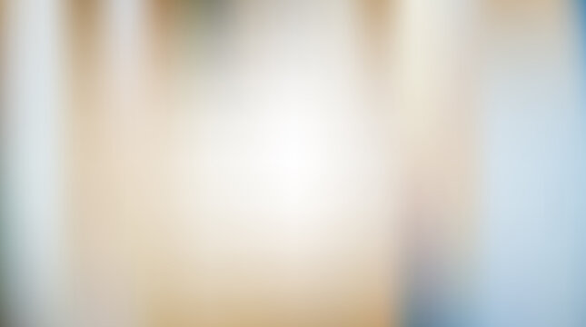 Soft golden light gradient background with warm amber tones and blurred atmosphere