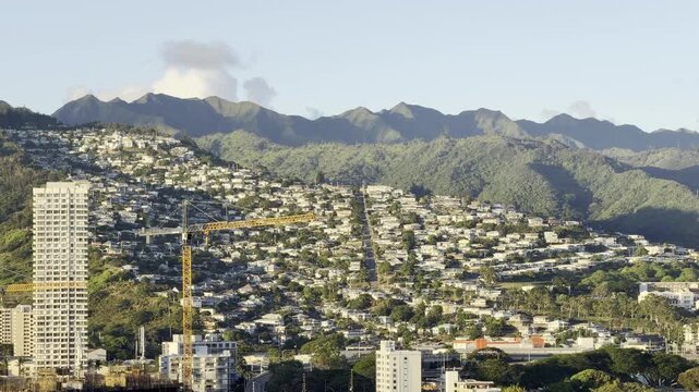 City of Honolulu, Oahu island, Hawaii. In the distance is the Koʻolau Range. Cumulus clouds with Trade Wind.	