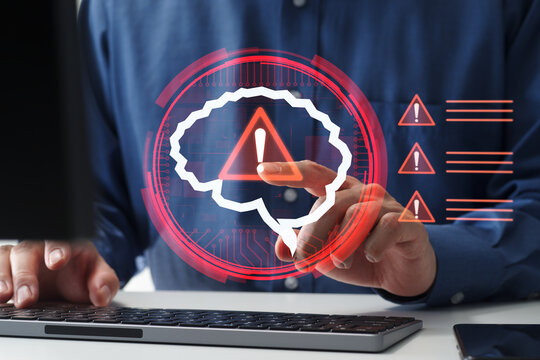 AI risks including information leakage and regulatory compliance issues. AI misuse and responsible AI challenges. Businessman tapping an AI icon with warning icon.