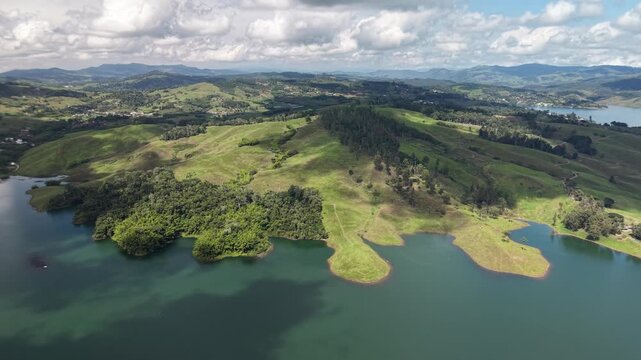 Lush green hills surrounding Lake Calima landscape