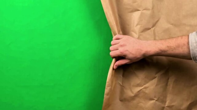Video, green-screen background, video transition with a hand pulling a curtain, 