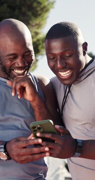Fitness, laugh and black men with phone outdoor for funny meme on social media, chatting or texting. People, happy and friends on cellphone for comic blog, joke or comedy article on sports in nature.