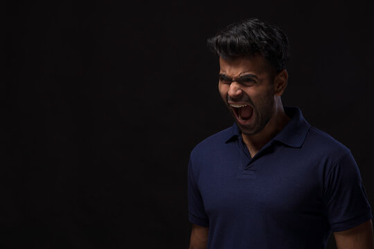 Portrait of a young man screaming 