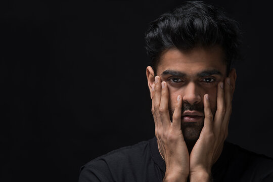 Closeup of a stressed man crying on the inside
