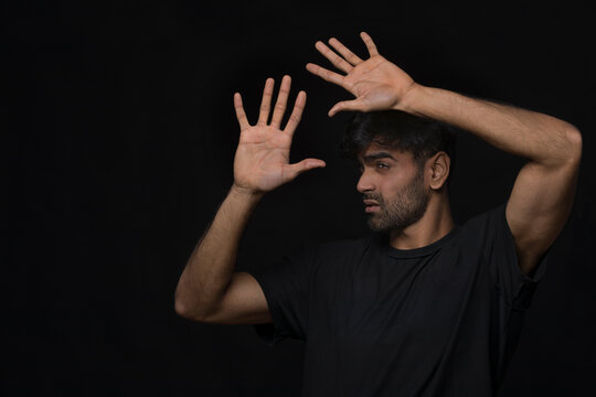 man with seasonal disorder blocking light with hands