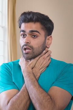 man suffocating from anxiety attack