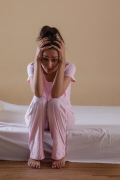 Young girl sitting alone in distress