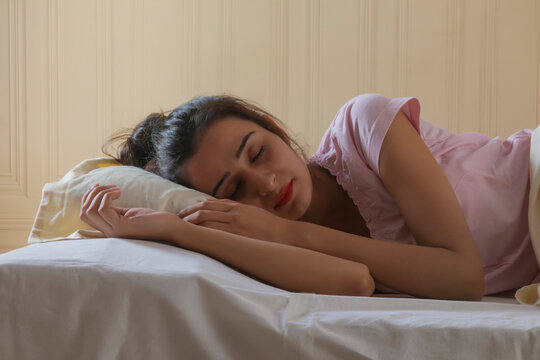young girl sleeping tension free at home