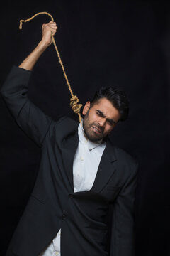 young corporate executive  hanging himself