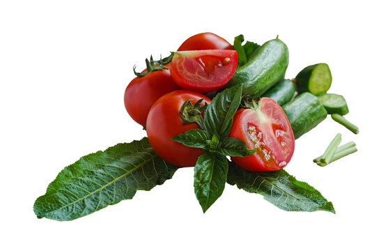 Tomatoes, cucumbers and greens on a white background