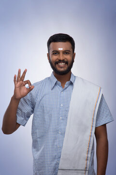 portrait of a south indian man smiling at the camera