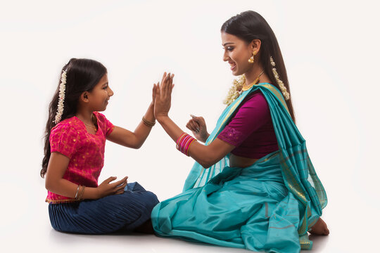 South indian mother playing with her daughter 