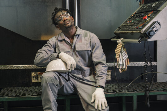 Portrait African industrial workers break time in factory