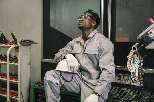 Portrait African industrial workers break time in factory