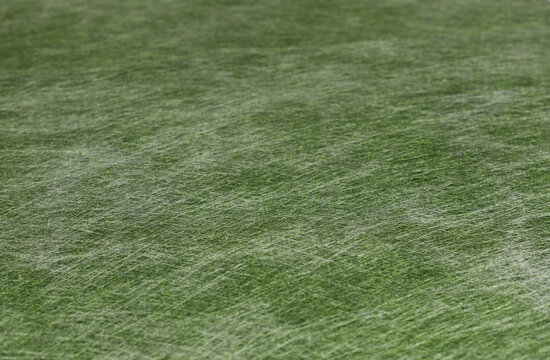 Texture of green non-wooven material for background.